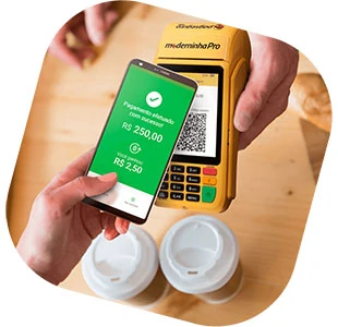 Ilustração com mão segurando celular e fazendo pagamento na Moderninha através do QR code